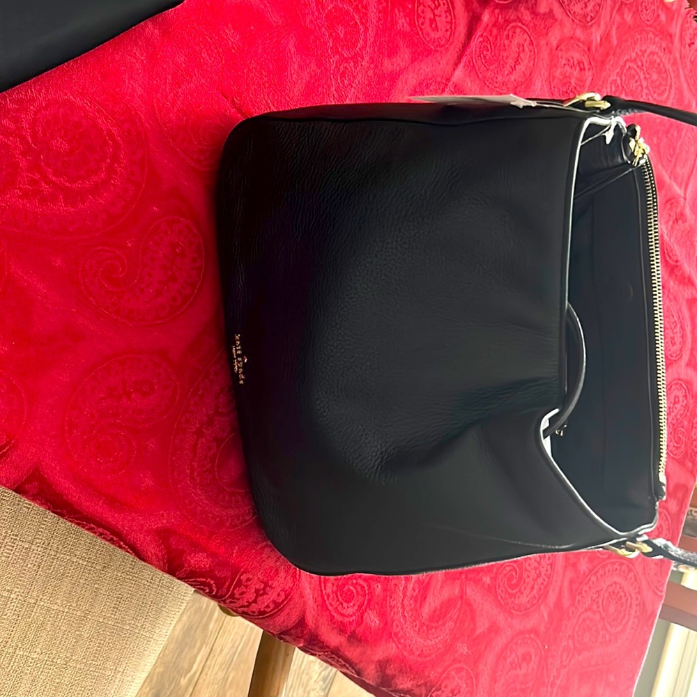 Kate spade purse and wallet sold Separately. Brand new- black.